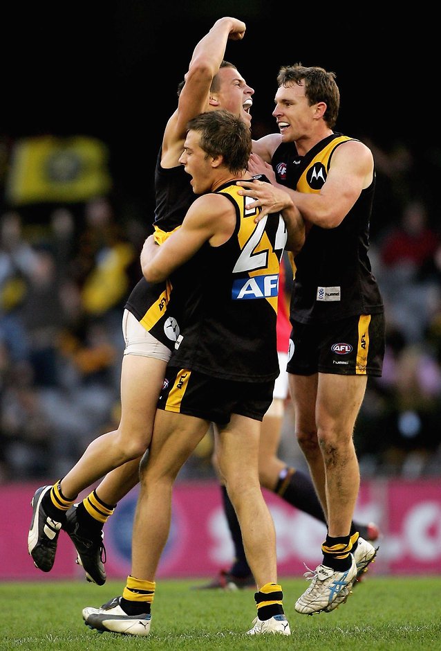 AFL 2006 Rd 8 - Richmond v Adelaide Crows Brett Deledio, Chris Newman and Mark Coughlan of the Tigers celebrate a goal during the round eight AFL match between the Richmond Tigers and the Adelaide Crows at the Telstra Dome May 20, 2006 in Melbourne, Australia.